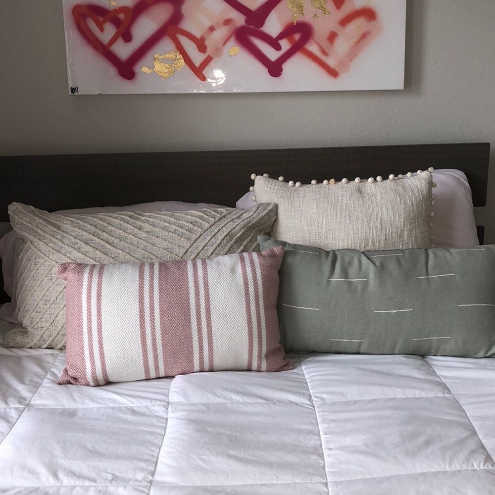 Four throw pillows! So cute for dorm/apartment